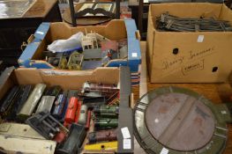 A collection of tin plate trains, carriages, accessories and track to include a turntable.
