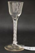 A Georgian wine glass with opaque double air twist stem.