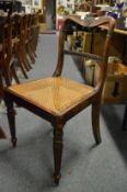 A good set of 19th century mahogany stained beech dining chairs with carved cresting rails, cane