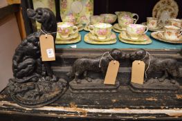 Cast iron dog door stops.