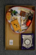 A small glass clock and miscellaneous collectables.