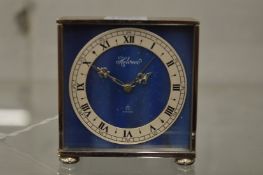 A small Helveco desk or bedside clock.