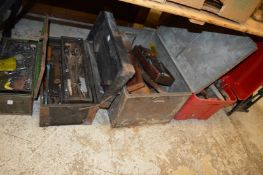 Four tool chests containing numerous tools.