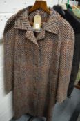 A Ladies Aquascutum herringbone design woollen coat.