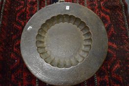 An Eastern finely engraved and enamel circular brass tray.