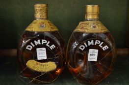 Two bottles of Dimple whisky.
