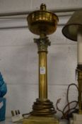 A brass corinthian column lamp.