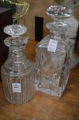 Two cut glass decanters.