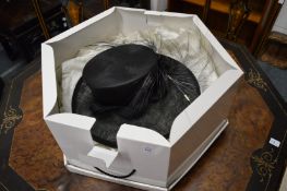 A Ladies hat, boxed.