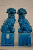 A pair of Chinese turquoise glazed lion dogs.