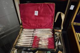 Three cases containing quantity of flatware.