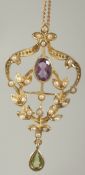 A silver gold plated amethyst peridot and pearl pendant and chain in a box.