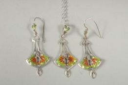 An art Nouveau design silver and enamel pendant chain and drop earrings in a box.