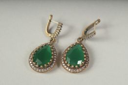 A pair of silver gilt chalcedony drop earrings in a box.