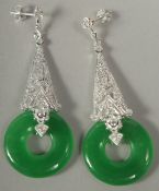 A pair of silver long drop Deco style jade earrings in a box.