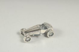 A novelty silver sports car, 3cm.