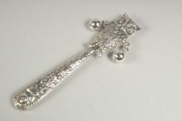 A silver owl rattle.