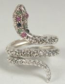 A silver ruby emerald and sapphire snake ring, size P, in a box.
