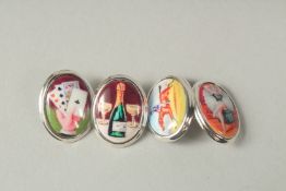 A pair of silver and enamel four vice cufflinks in a box.