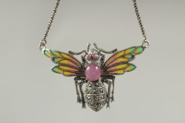 A silver cabochon ruby plique enamel bee necklace in a box.