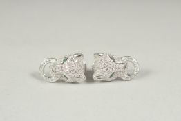 A good pair of silver panther earrings in a box.