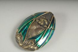 A brass and enamel bat vesta case.