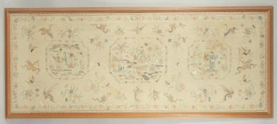 A LARGE CHINESE EMBROIDERED SILK TEXTILE PANEL, with three panels of immortals and further decorated