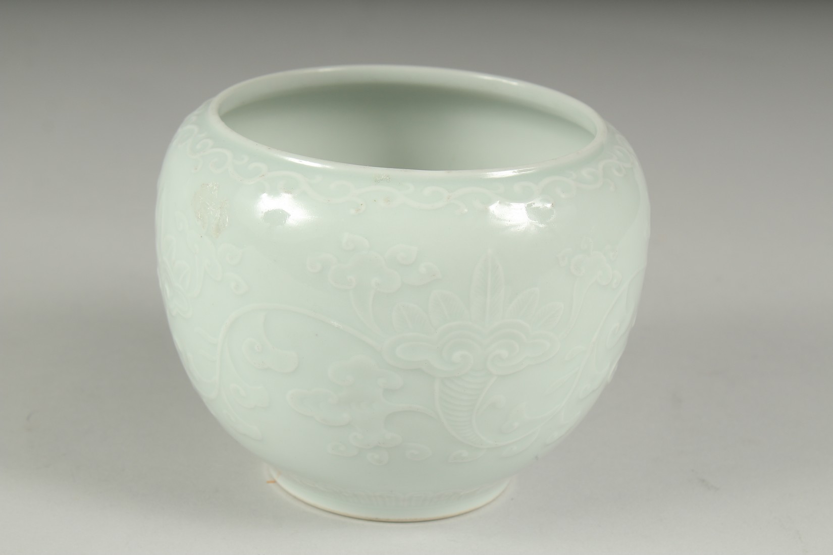 A CHINESE REPUBLIC PERIOD WHITE CELADON PORCELAIN POT, with carved ruyi stylised foliate decoration, - Image 2 of 7