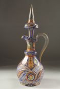 A 19TH CENTURY ISLAMIC, OTTOMAN MARKET, ENAMEL OVERLAID BOHEMIAN GLASS JUG DECANTER AND STOPPER,