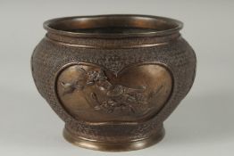 A JAPANESE BRONZE JARDINIERE, with relief panels of birds, 19cm diameter.