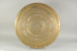 A LARGE ISLAMIC CAIROWARE SILVER AND COPPER INLAID BRASS TRAY, 61.5cm diameter.