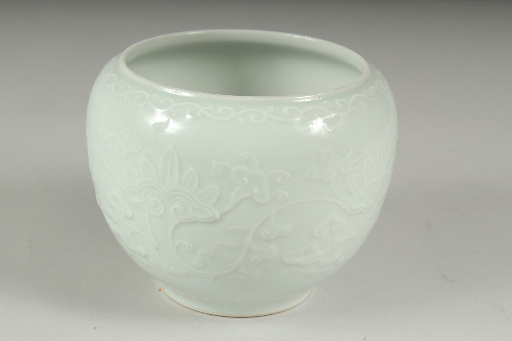 A CHINESE REPUBLIC PERIOD WHITE CELADON PORCELAIN POT, with carved ruyi stylised foliate decoration, - Image 4 of 7