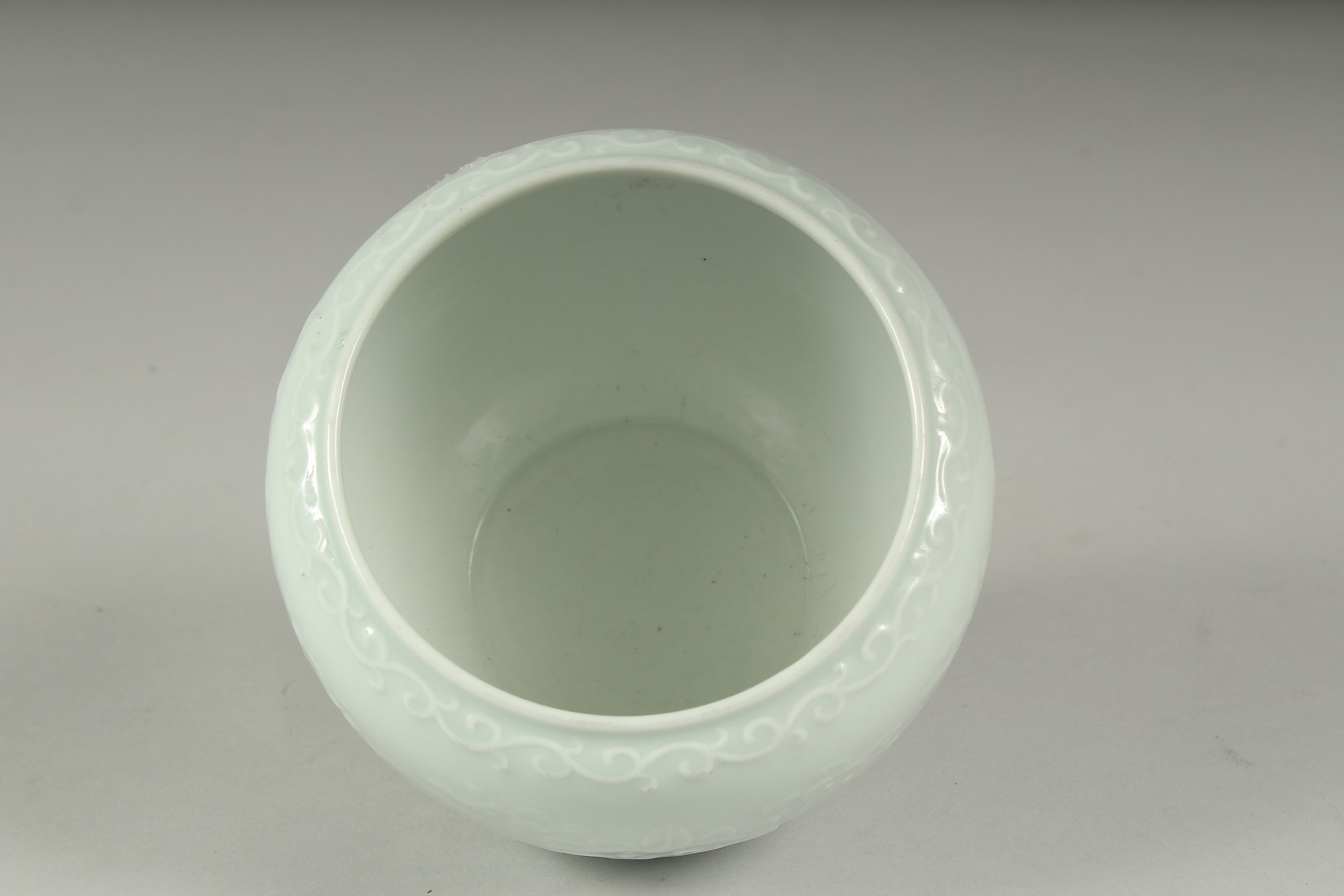 A CHINESE REPUBLIC PERIOD WHITE CELADON PORCELAIN POT, with carved ruyi stylised foliate decoration, - Image 5 of 7