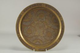 A CAIROWARE SILVER AND COPPER INLAID BRASS TRAY, 34cm diameter.