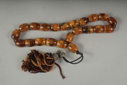A STRING OF PRAYER BEADS.
