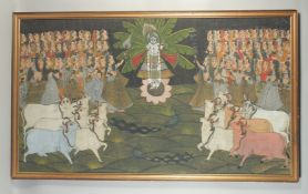 A VERY LARGE 19TH / EARLY 20TH CENTURY FRAMED INDIAN PAINTED TEXTILE, depicting Krishna amongst