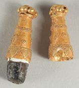 A SMALL BYZANTINE GOLD ITEM - POSSIBLY A SEAL STAMP.