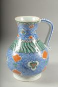 AN OTTOMAN TURKISH GLAZED POTTERY WATER JUG, 20.5cm high.