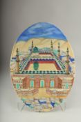 A TURKISH GLAZED POTTERY OVAL PLAQUE DEPICTING MECCA, 43cm x 30.5cm.