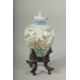 A SMALL CHINESE REPUBLIC PERIOD PORCELAIN JAR AND COVER, on a fitted wooden stand, painted with - Image 1 of 5