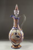 A LARGE 19TH CENTURY ISLAMIC, OTTOMAN MARKET, ENAMEL OVERLAID BOHEMIAN GLASS JUG DECANTER AND