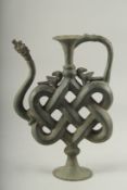 A VERY UNUSUAL INDIAN BRONZE OR BRASS EWER, 28cm high.