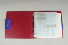 A FOLDER OF SUNDRY COINS.