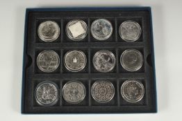A SET OF TWELVE VARIOUS SILVER CROWNS including Edward VII and 11 Elizabeth II. Boxed.