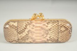 ALEXANDER MCQUEEN. A SNAKESKIN CLUTCH BAG. 9ins long.
