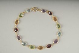 AN 18CT GOLD MULTI GEM BRACELET in a box.