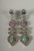 A PAIR OF SILVER EMERALD, RUBY AND SAPPHIRE LONG DROP EARRINGS.