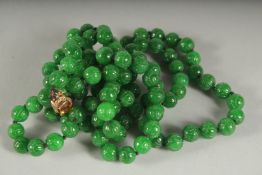 A SUPERB CARVED JADE DOUBLE ROW NECKLACE with citrine and diamond clasp.