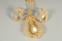 A PAIR OF SILVER, GOLD PLATED OPAL SET EARRINGS AND PENDANT AND CHAIN.