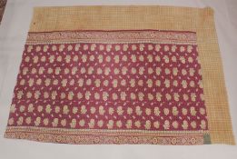 A QUILTED BEDSPREAD cream ground with six square panels of geometric designs. 7ft 5ins x 4ft 8ins.